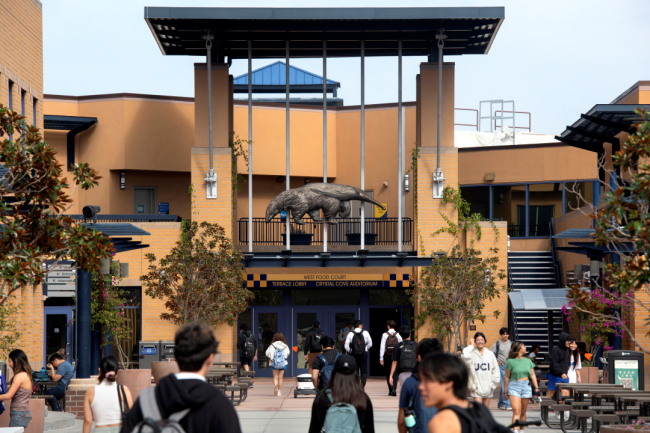 Students walk on the University of California, Irvine, campus